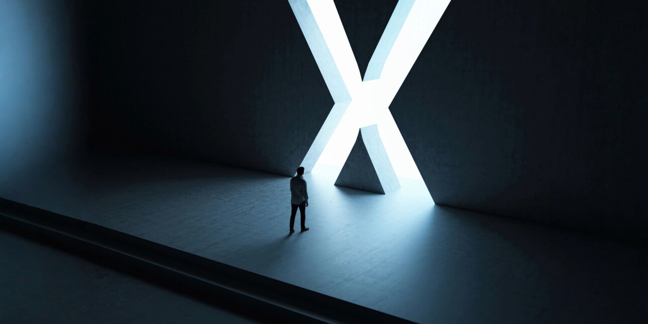 A dark illustration of a man on stage approaching a large, glowing-white letter X cut out of the backdrop