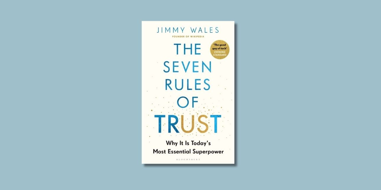 The white typographical cover of The Seven Rules of Trust on an eggshell blue background