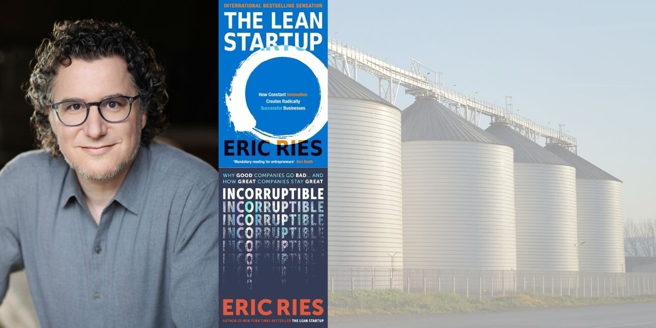 A composite image of Eric Ries, a white man with dark hair, wearing spectacles and a grey polo shirt, and the book jackets of The Lead Start Up and Incorruptible overlaid on a photograph of metal silos.