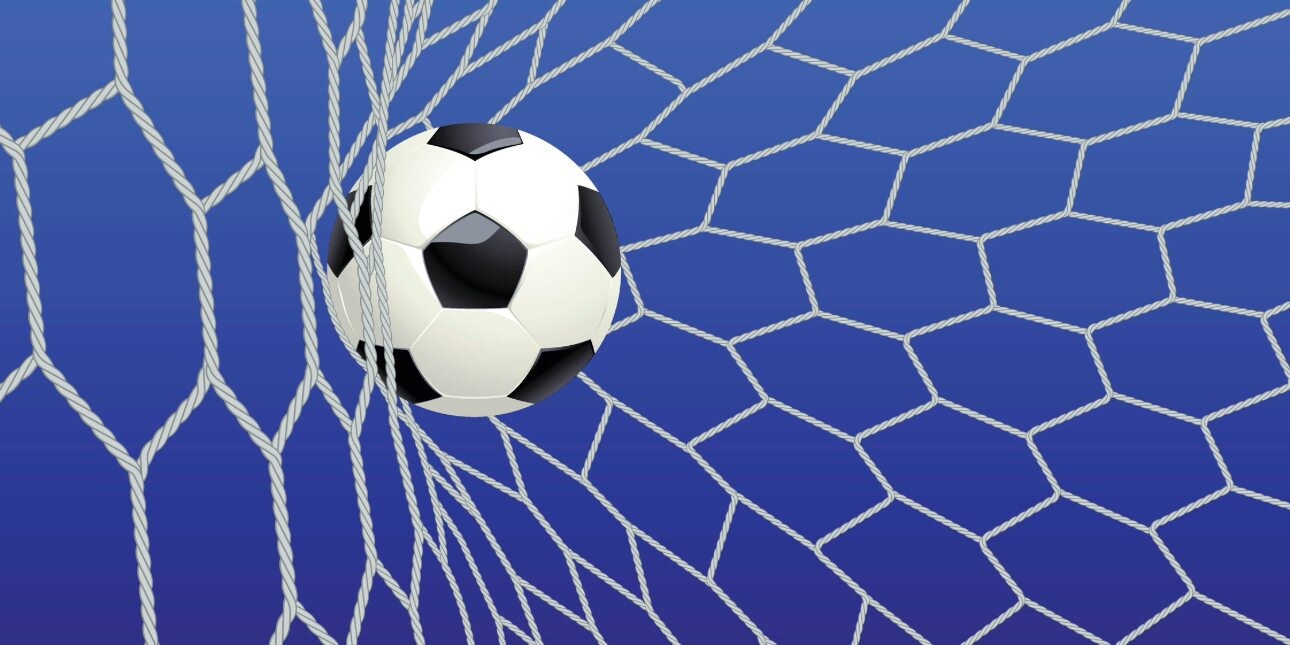 A computer generated image of a white and black football hitting the back of a white football net.