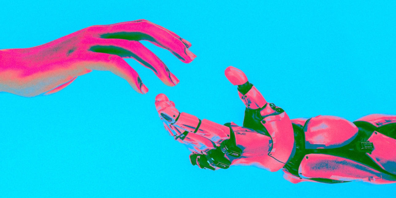 A hesitant human hand about to hold hands with a robot hand