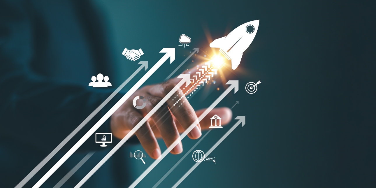 Digital image of a hand reaching out to ignite a spark in an illustration of a rocket. Following its upward trajectory are arrows and various icons including a globe, bullseye, cloud, people, stocks graph and a handshake