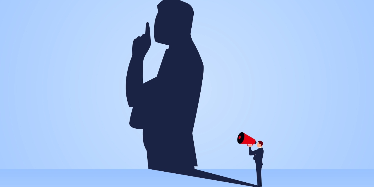Illustration of a miniature man holding a loud speaker. His shadow is projected on a wall but it shows man holding his fingers to his lips to suggest remaining silent