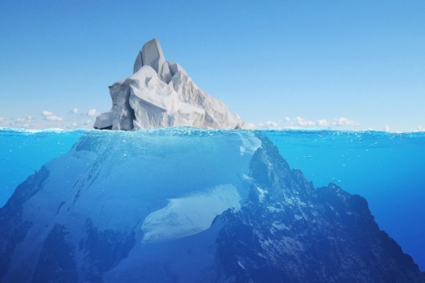 A graphic of an iceberg above and below the sea.