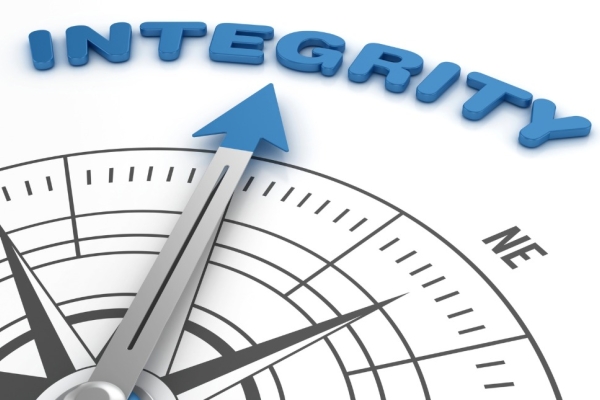 A digital image of a compass needle pointing to the word Integrity written in blue.