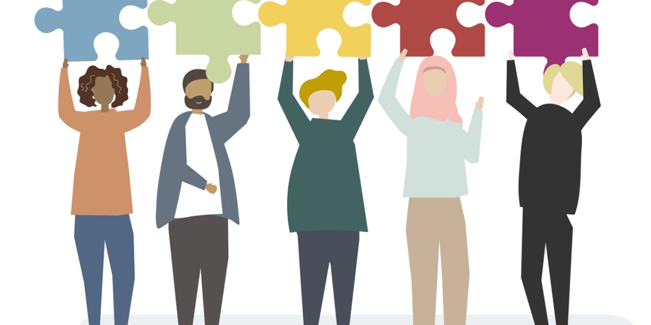 Illustration of five people with different skin tones and hair colour, including one wearing a hijab. Each holds up a large coloured jigsaw piece.
