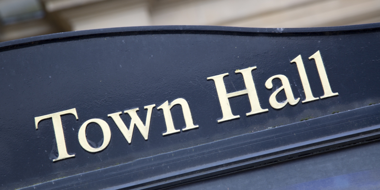 The words town hall written on a sign