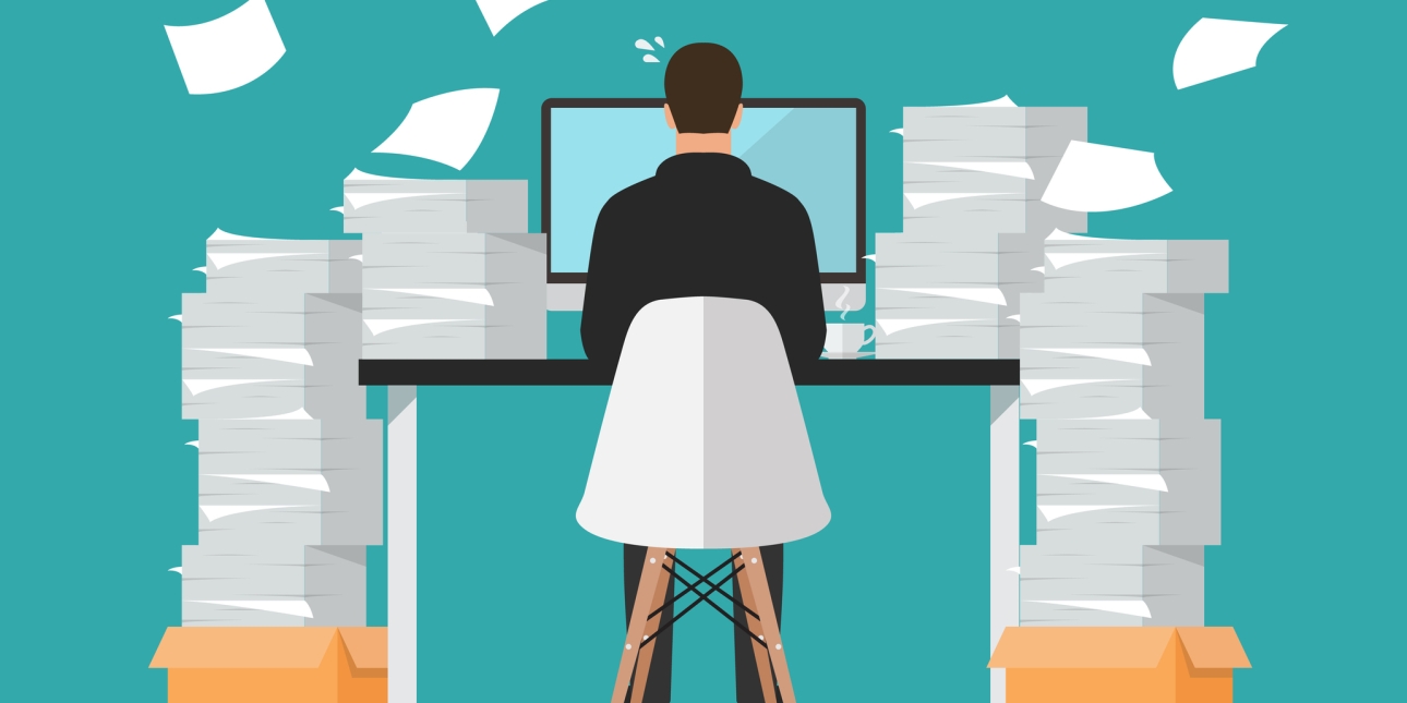 Illustration showing the back of a man working at a desk. He is surrounded by piles of paperwork
