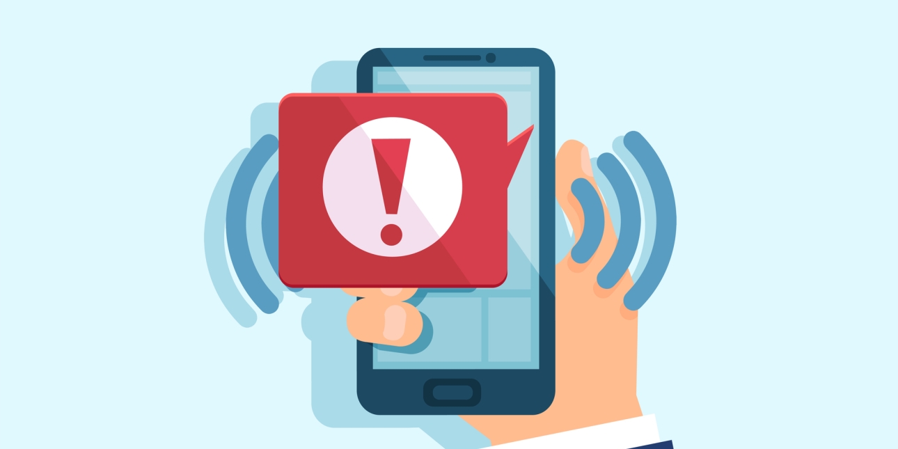 Illustration of a hand holding a mobile phone. A red message icon containing a red explanation mark in a white circle overlaps the screen. There sets of curved lines suggesting an audible alert.