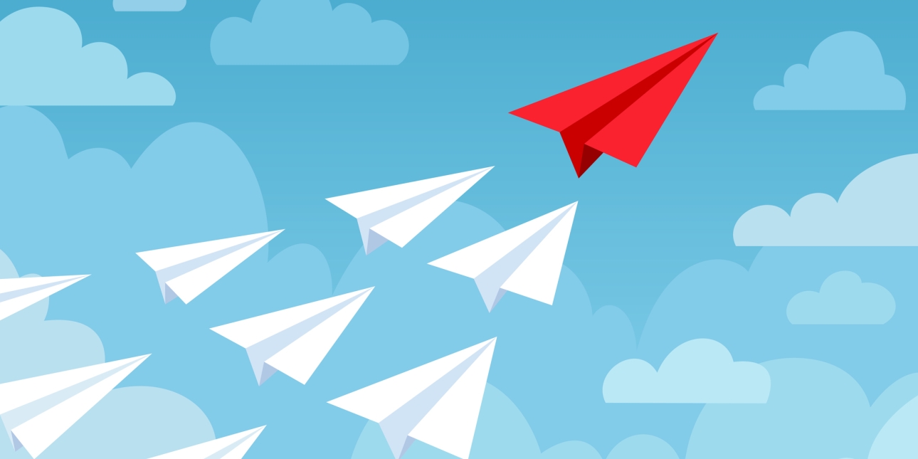 A red paper aeroplane leads nine white paper planes in an upward trajectory through illustrated sky and clouds