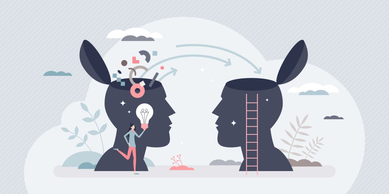 Illustration of two silhouette side profile heads that have been opened at the top. Arrows and shapes are being transferred from the head on the left to the head on the right. A figure holding a lightbulb is stood in front of the head on the left.