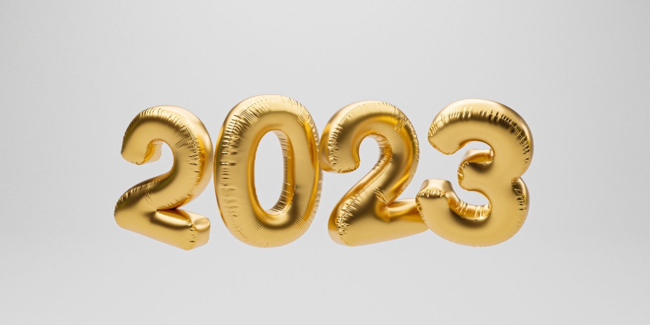 The year 2023 represented as four gold coloured balloons