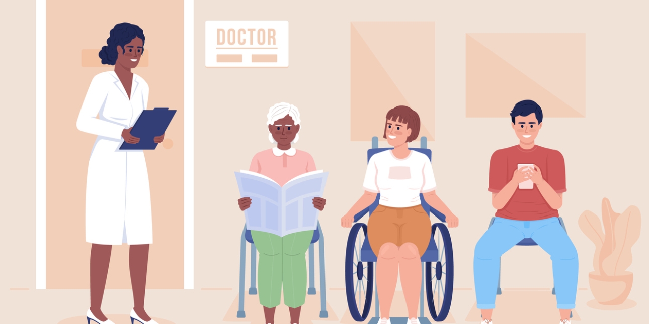 A female doctor in a white lab coat stands next to three patients in the waiting room. The patients are two women and a man. The woman in the middle uses a wheelchair. The other two are sat on chairs.