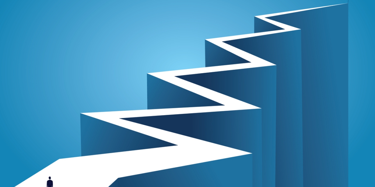 Illustration of a person stood at the end of jagged precipice which zig zags and narrows to a point on the horizon