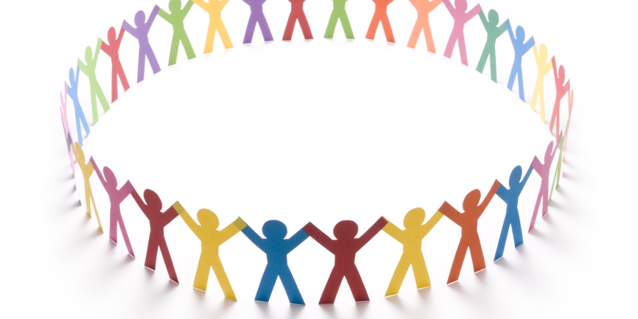 A circle of multicoloured paper chain figures