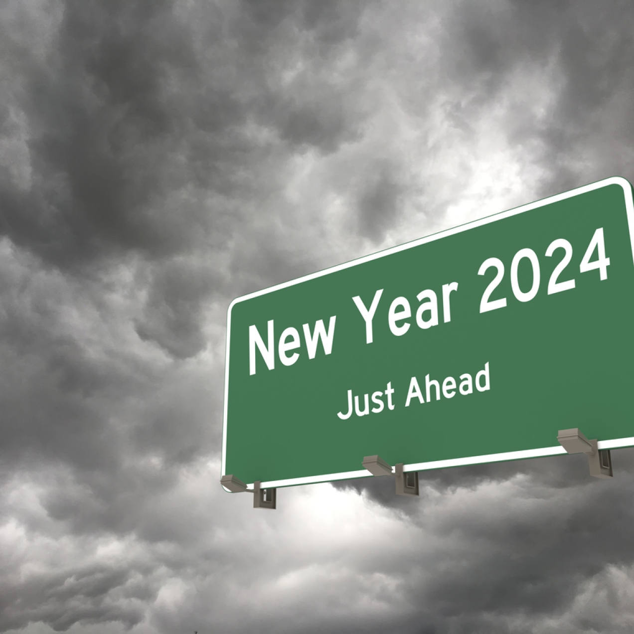 Grey storm clouds surround a green traffic sign, fixed to a gantry, which features the words New Year 2024 just ahead