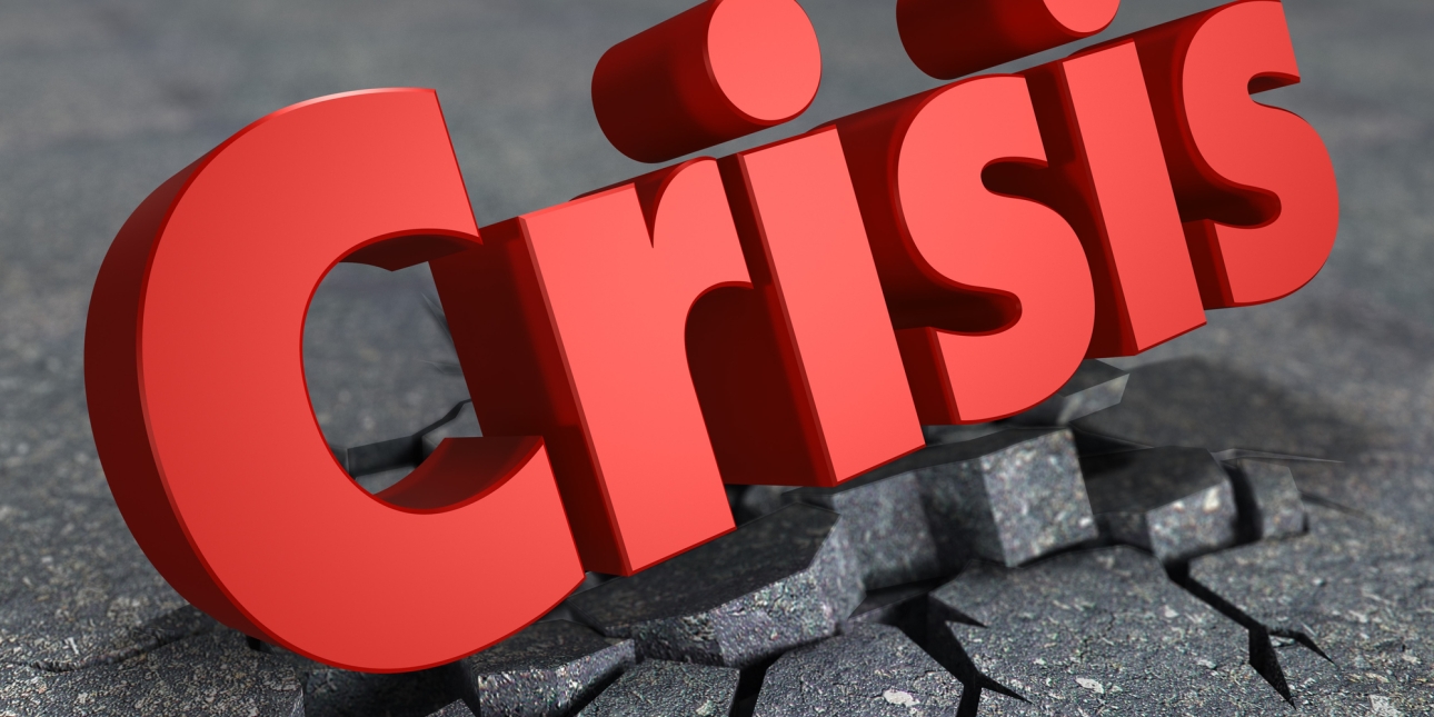 A three dimensional render of the word crisis written in red. The