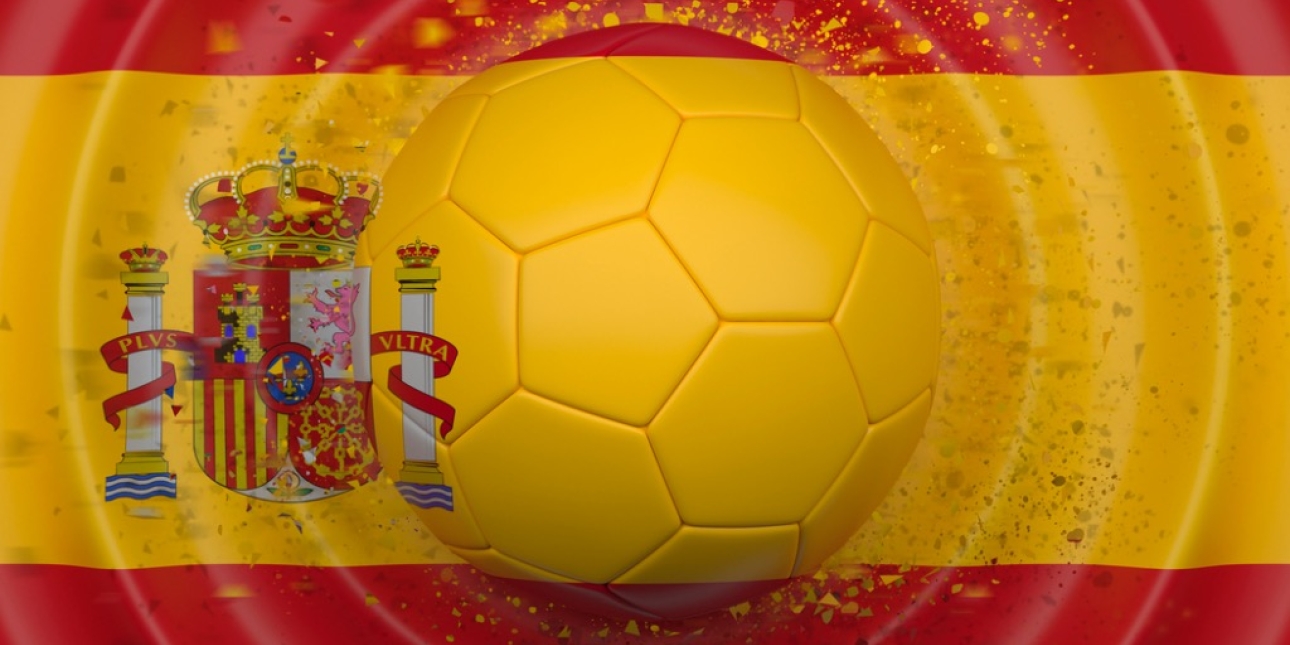 The transparent football in the centre of the Spanish flag. There are circular waves around the football.