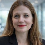 A colour portrait of Josephine Ornago. Josephine is a white woman wearing a black jacket.