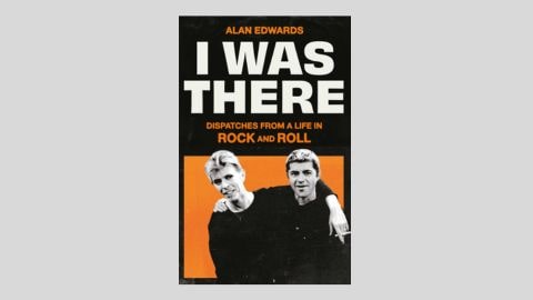 Black and orange book cover of I Was There, featuring a black and white photo of David Bowie and Alan Edwards