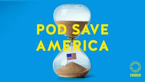 Sand flowing throw an egg timer. The bottom vessel also includes a miniature US flag on a stick. The words Pod Save America feature across the centre. The background is blue.